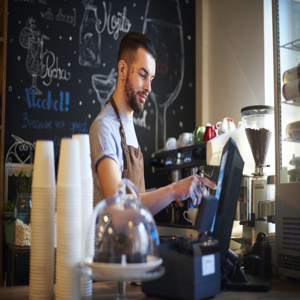 Barista using cash register