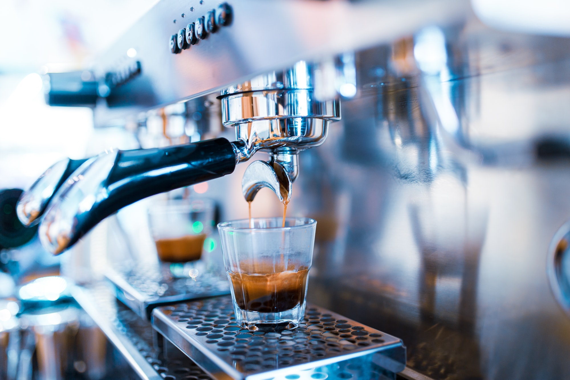 Espresso machine detail view with copy space.